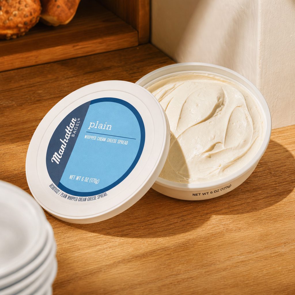 Tub of manhattan bagel plain cream cheese.